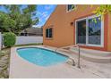 A refreshing splash pool invites relaxation, with modern finishes complemented by the vibrant outdoor scenery at 5207 Moeller Ave, Sarasota, FL 34233