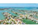 Aerial view of waterfront homes with boat docks and access to the bay, marked by location pin at 7889 3Rd S Ave, St Petersburg, FL 33707