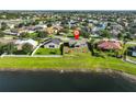 Lovely home situated on a well-manicured lot with a serene lake backdrop in a quiet neighborhood at 10540 Carloway Hills Dr, Wimauma, FL 33598