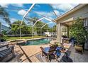 Inviting screened-in pool area with a spa, perfect for relaxation and entertainment at 11519 Cypress Reserve Dr, Tampa, FL 33626