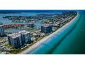 Beautiful aerial view showcasing beachfront condos along the Gulf Coast, with stunning turquoise waters at 1600 Gulf Blvd # 212, Clearwater Beach, FL 33767
