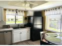 Bright eat-in kitchen with modern appliances, tile floors and great natural light at 2513 Oakleaf Ln # 26C, Clearwater, FL 33763