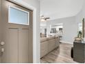 Inviting home entryway showcasing open floor plan with views of the living area and kitchen at 2988 Sugar Bear Trl, Palm Harbor, FL 34684
