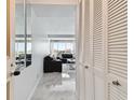 Inviting living room with marble floors and a view of the water at 31 Island Way # 609, Clearwater Beach, FL 33767