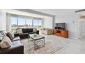 Bright living room with tile floors and expansive windows boasting a scenic vista at 31 Island Way # 609, Clearwater Beach, FL 33767