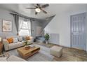 Bright living room with hardwood floors, plush seating, and a ceiling fan at 3604 Brigadoon Cir # 3604, Clearwater, FL 33759