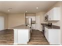Modern kitchen featuring stainless steel appliances and dark countertops at 37222 Sagemoor Dr, Zephyrhills, FL 33541