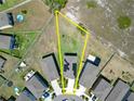 Aerial view highlighting solar panels and property lines in a neighborhood setting at 4513 Eternal Prince Dr, Sun City Center, FL 33573