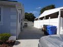 Exterior view of the driveway with a white fence and landscaping at 4529 W Knox St, Tampa, FL 33614