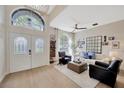 Bright living room with large windows, neutral tones, and stylish furnishings at 5212 Twin Creeks Dr, Valrico, FL 33596