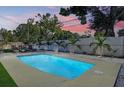 Inviting backyard pool surrounded by lush greenery, offering a private oasis for relaxation and recreation at 9948 51St N Ave, St Petersburg, FL 33708