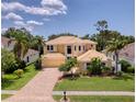 Beautiful two-story home with well-maintained landscaping and a brick driveway at 12610 Eagles Entry Dr, Odessa, FL 33556