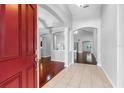 Welcoming foyer with tile flooring, high ceilings, and seamless flow into adjacent living spaces at 16522 Ivy Lake Dr, Odessa, FL 33556