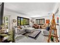 Bright and open living room with hardwood floors, comfortable seating, and stylish decor throughout at 230 32Nd N Ave, St Petersburg, FL 33704