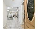 Bright foyer that leads to a spacious living area with neutral tones and ample natural light at 4161 Rolling Springs Dr, Tampa, FL 33624