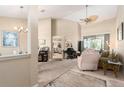 Open living room features high ceilings, neutral colors, and seamless transition to other spaces at 4656 Copper Hill Dr, Spring Hill, FL 34609