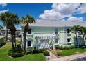 Charming waterfront condo with a well-maintained lawn and covered front patio at 4799 Coquina Key Se Dr, St Petersburg, FL 33705