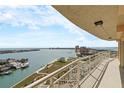 Relax on this spacious balcony with views of water, a park, and nearby city buildings at 4900 Brittany S Dr # 1414, St Petersburg, FL 33715