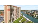 Tall waterfront condo building featuring private balconies and lush landscaping at 4900 Brittany S Dr # 1414, St Petersburg, FL 33715