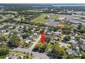 Aerial view of a home nestled in a suburban neighborhood close to a school, baseball fields and highway access at 2961 Stockwood Dr, Clearwater, FL 33761
