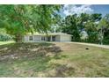 Charming single-Gathering home featuring well-maintained landscaping and a two-car garage at 3206 Shalimar Ter, North Port, FL 34286