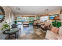 Comfortable lobby featuring tiled floor, seating and artwork to welcome you home at 4550 Cove Cir # 502, St Petersburg, FL 33708
