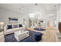 Bright, open-concept living room and dining area with modern furnishings and plenty of natural light at 5269 White Sand Ne Cir, St Petersburg, FL 33703