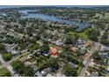 An aerial view of a neighborhood with a lake visible in the background at 627 38Th Ne Ave, St Petersburg, FL 33704