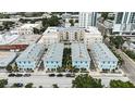 An aerial view showing a block of townhomes with private driveways, mature landscaping, and neighborhood streets at 813 Burlington N Ave, St Petersburg, FL 33701