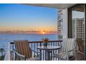 Relax on the balcony with seating and enjoy breathtaking ocean views at sunset at 1600 Gulf Blvd # 618, Clearwater, FL 33767