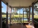 Relaxing screened-in lanai boasting serene water and golf course views, perfect for enjoying the outdoors at 18228 Paradise Point Dr, Tampa, FL 33647