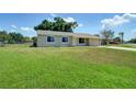 A charming single-story home with a well-maintained lawn and attached one car garage at 3262 Montclair Cir, North Port, FL 34287