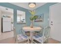 Cozy dining area with blue walls, a round table, and seating for four at 3510 41St S Ave # 168, St Petersburg, FL 33711