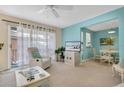 Bright living room with comfortable seating and a view to the dining area and balcony at 3510 41St S Ave # 168, St Petersburg, FL 33711