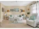Inviting living room featuring neutral walls, white furniture, and bright, beachy decor at 3510 41St S Ave # 168, St Petersburg, FL 33711
