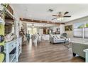 Bright, open-concept living room showcasing elegant flooring and ceiling fans and stylish decor at 4462 2Nd S Ave, St Petersburg, FL 33711