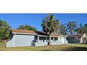 Well-maintained single-story home with a front porch and an attached one car garage at 1007 Greenleaf Way, Tarpon Springs, FL 34689