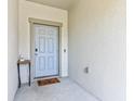 Welcoming entryway with a neutral color palette and a decorative table at 14323 Easy Goer St, Ruskin, FL 33573