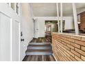 Entryway view featuring hardwood floors, and a view into the living room at 1902 W Nassau St, Tampa, FL 33607