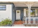 Inviting front porch with decorative railings and a traditional front door at 1902 W Nassau St, Tampa, FL 33607