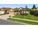 Well-maintained single-story home with a two-car garage and beautiful landscaping at 3148 Sago Point Ct, Land O Lakes, FL 34639