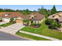Well-maintained single-story home with a two-car garage and beautiful landscaping at 3148 Sago Point Ct, Land O Lakes, FL 34639