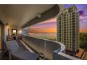 Relaxing on the condo balcony provides sunset water views from the unit at 4141 Bayshore Blvd # 1204, Tampa, FL 33611