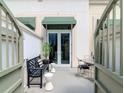 Private outdoor patio space with seating and decorative plants, offering a serene and inviting atmosphere at 450 Knights Run Ave # 414, Tampa, FL 33602