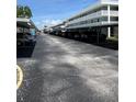 Outdoor parking area with covered carports for residents of this condominium community in a clean and organized setting at 4715 Bay Ne St # 235, St Petersburg, FL 33703