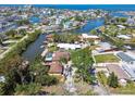 Stunning aerial view of waterfront homes and canals, showcasing a serene coastal community with boat docks at 6732 Udell Ln, Hudson, FL 34667