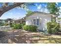 A charming single-story home featuring well-maintained landscaping at 7703 W Hiawatha St, Tampa, FL 33615