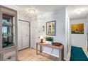 Bright foyer featuring tile flooring, closet, and a console table with decor at 101 Dogwood Cir, Seminole, FL 33777