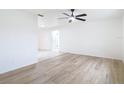 Spacious living room featuring wood floors and abundant natural light at 12083 Rockford St, Spring Hill, FL 34608