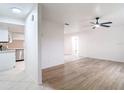 Bright and airy living room with modern wood flooring and ceiling fan at 12083 Rockford St, Spring Hill, FL 34608